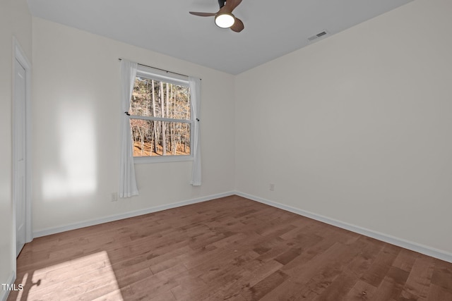 unfurnished room with hardwood / wood-style floors and ceiling fan