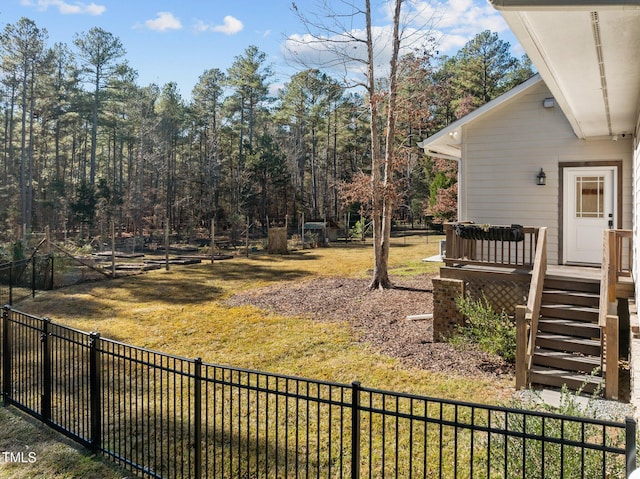 view of yard featuring a wooden deck