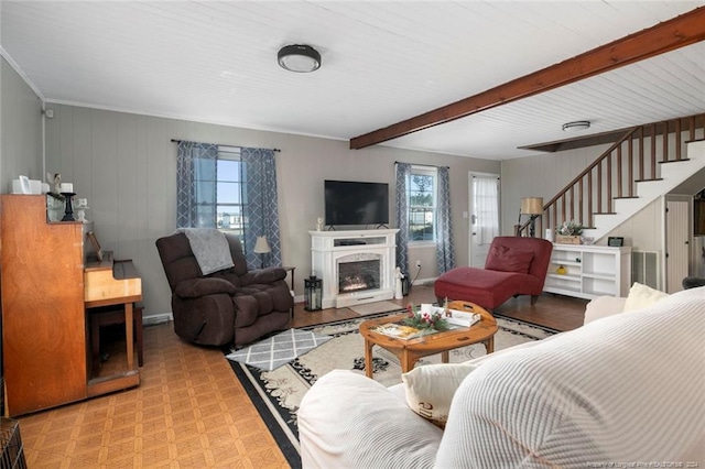living room featuring beam ceiling