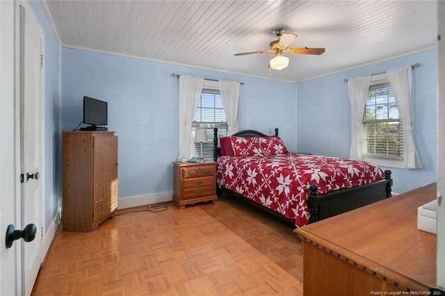 bedroom featuring parquet flooring, multiple windows, ornamental molding, and ceiling fan