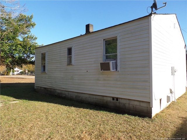 view of property exterior with a yard