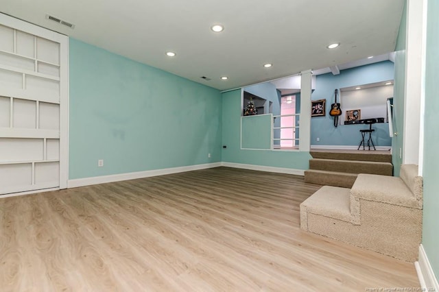 unfurnished living room featuring hardwood / wood-style floors