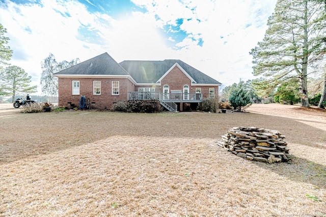 back of house featuring a wooden deck