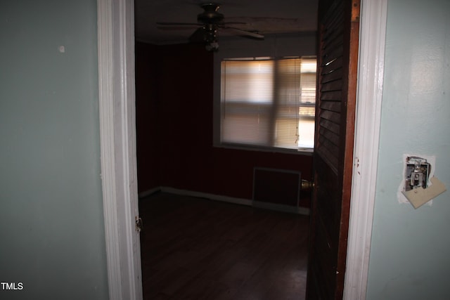 hall with dark hardwood / wood-style flooring