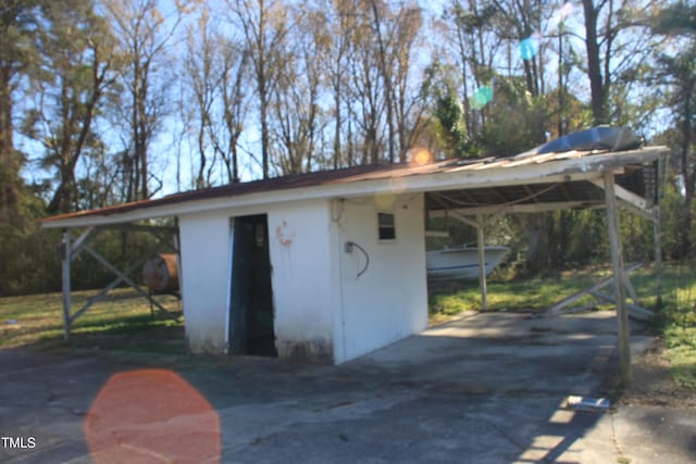 exterior space with a carport