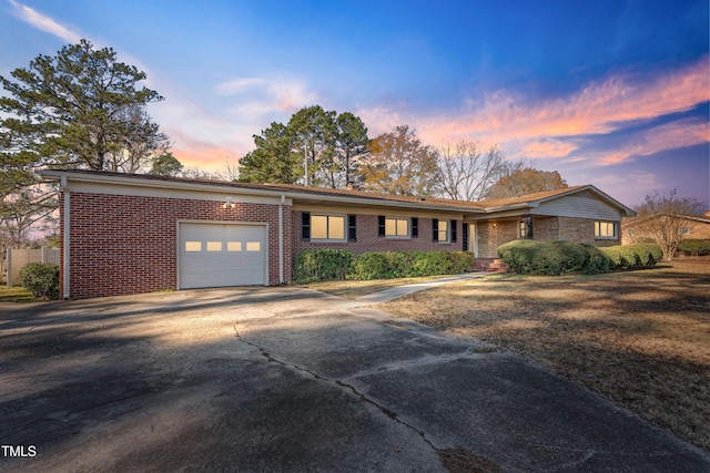 ranch-style house featuring a garage