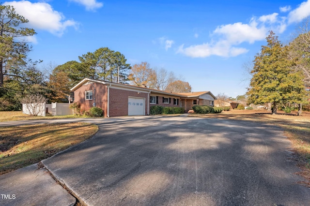 ranch-style house featuring a garage