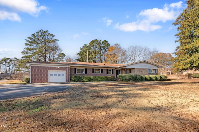 single story home featuring a garage