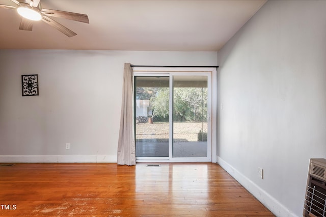 spare room featuring light wood-type flooring and ceiling fan