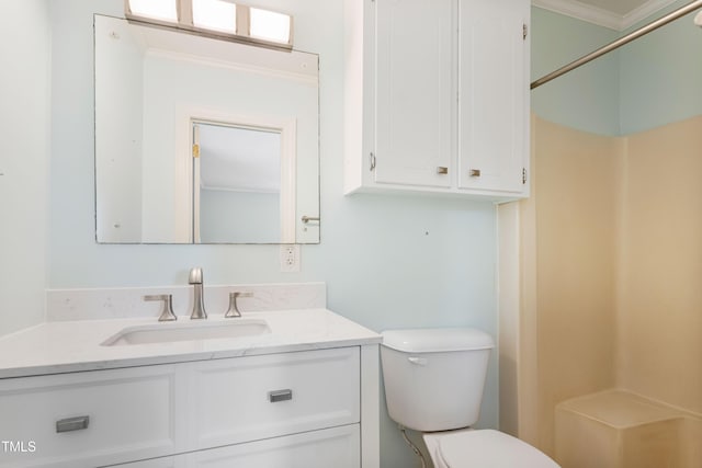 bathroom featuring a shower, toilet, vanity, and ornamental molding