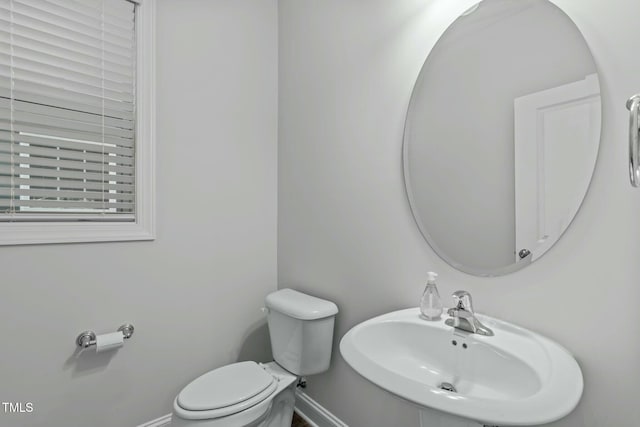 bathroom featuring sink and toilet