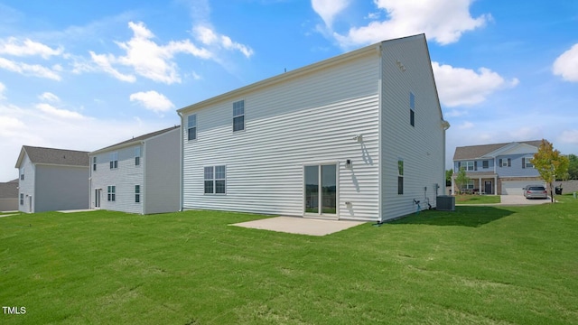 rear view of house with a yard, a patio area, and central air condition unit