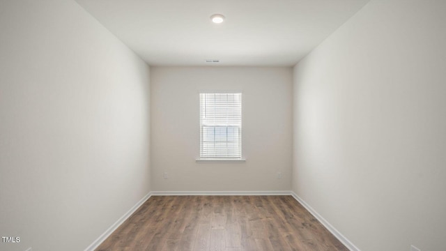 unfurnished room featuring hardwood / wood-style flooring