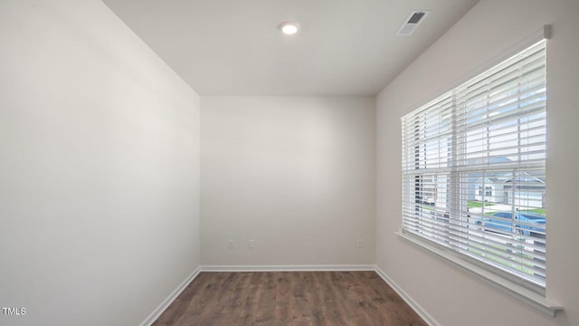 unfurnished room featuring dark hardwood / wood-style floors