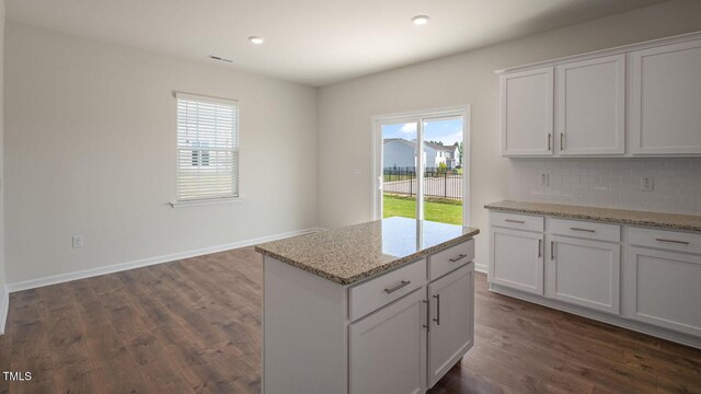273 Hanging Elm Ln, Fuquay Varina, NC 27526 - kitchen featuring dark wood-style flooring, white cabinets, backsplash, light stone counters, and recessed lighting
