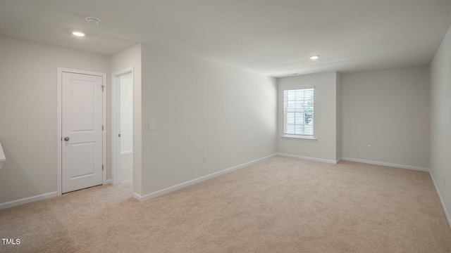 273 Hanging Elm Ln, Fuquay Varina, NC 27526 - unfurnished room featuring light colored carpet, recessed lighting, and a smoke detector