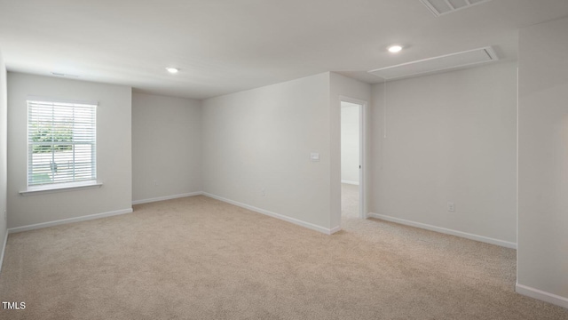 273 Hanging Elm Ln, Fuquay Varina, NC 27526 - spare room featuring attic access, light carpet, and recessed lighting