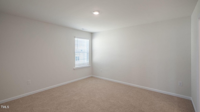 view of carpeted spare room