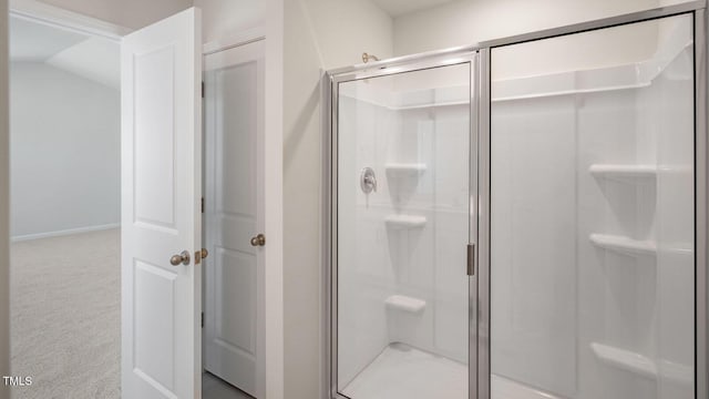 bathroom with lofted ceiling and walk in shower