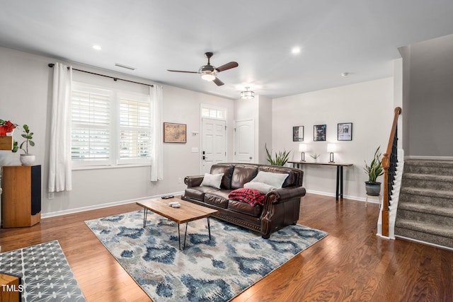 living room with hardwood / wood-style flooring and ceiling fan