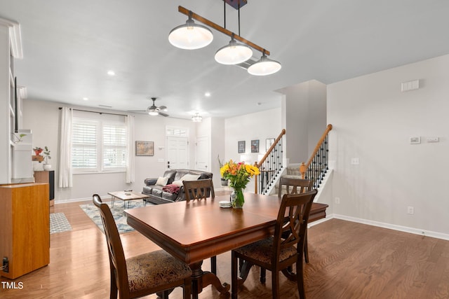 dining room featuring hardwood / wood-style floors and ceiling fan