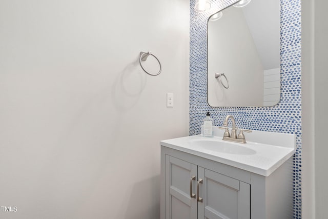 bathroom with vanity and backsplash