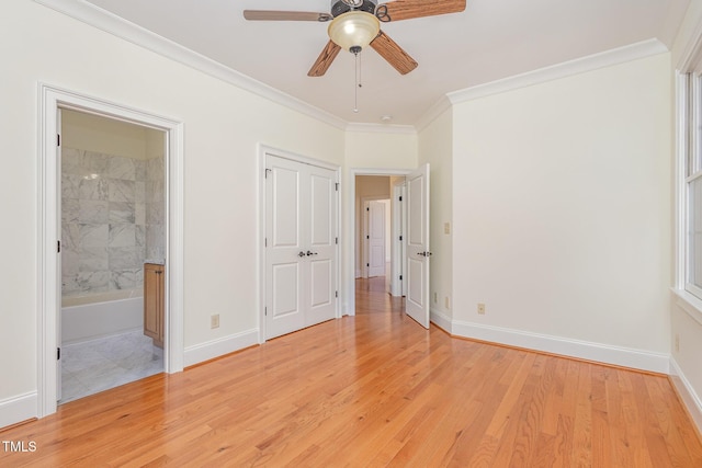 unfurnished bedroom featuring light hardwood / wood-style flooring, ensuite bath, ceiling fan, and ornamental molding