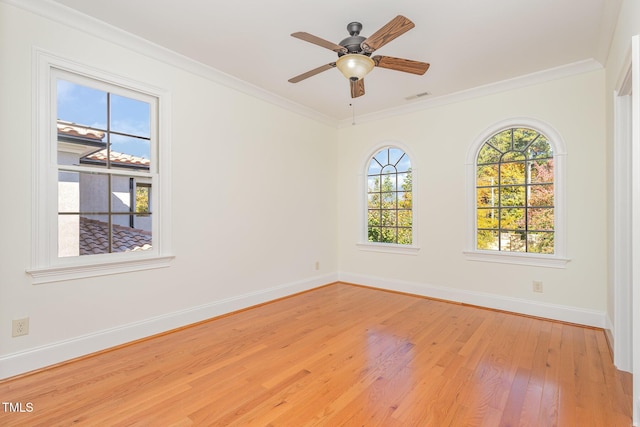 unfurnished room featuring light hardwood / wood-style flooring, ceiling fan, and crown molding