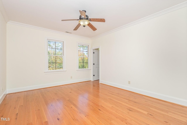 empty room featuring light wood-type flooring, ceiling fan, and crown molding