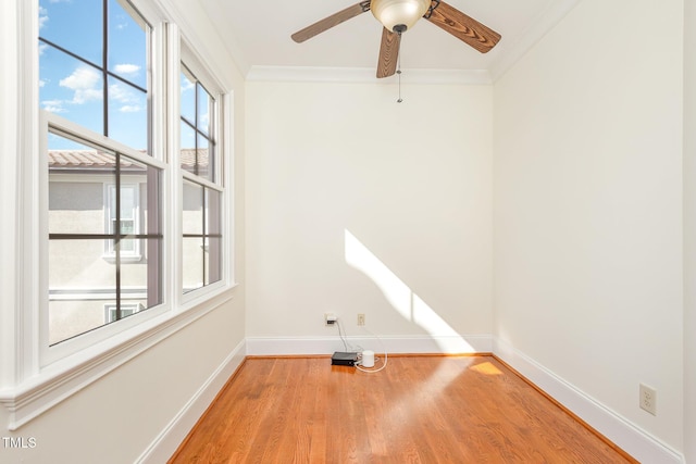 unfurnished room with hardwood / wood-style floors, ceiling fan, and ornamental molding