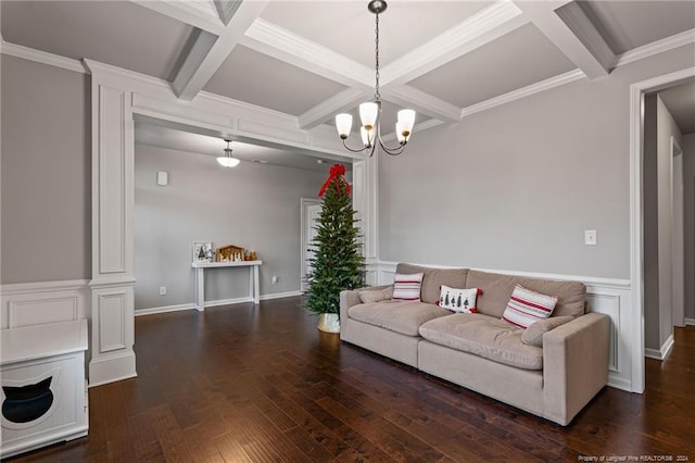 living room featuring dark hardwood / wood-style floors, beam ceiling, crown molding, and coffered ceiling