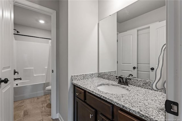 full bathroom with shower / tub combo, vanity, and toilet