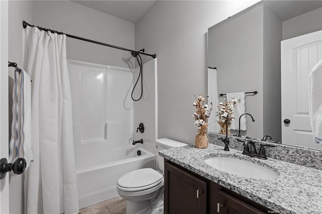 full bathroom with shower / tub combo, vanity, and toilet