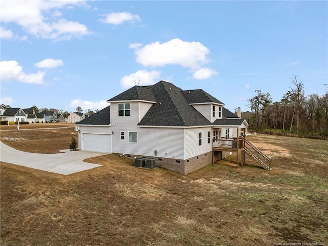 view of home's exterior featuring central AC and a garage