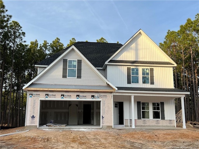 view of front of home with covered porch and a garage