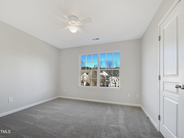 empty room with ceiling fan and carpet