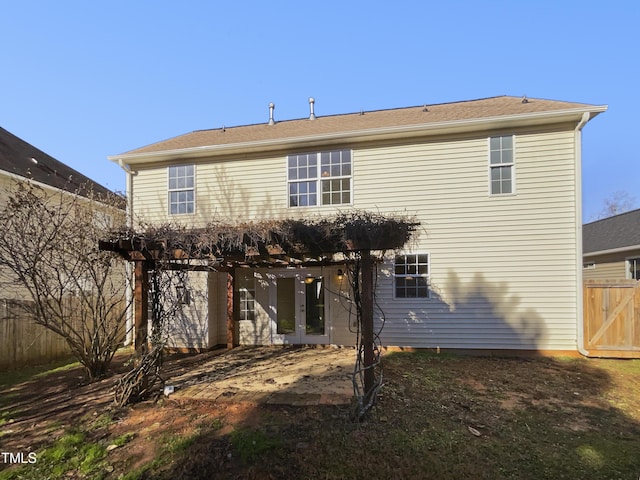 back of house with a pergola and french doors