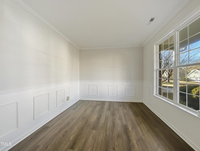 unfurnished room featuring dark hardwood / wood-style floors and crown molding