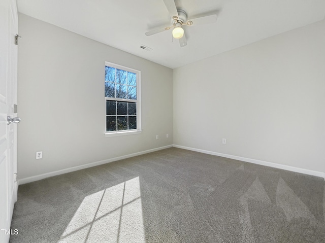 empty room with carpet and ceiling fan