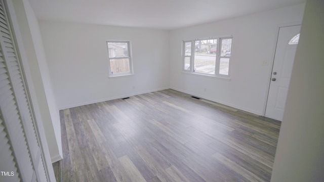 unfurnished room featuring light hardwood / wood-style floors