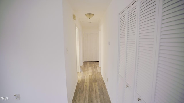 hallway featuring light hardwood / wood-style flooring