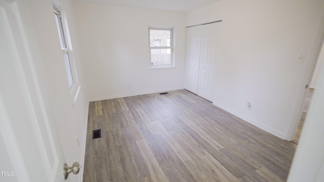 unfurnished room featuring light hardwood / wood-style floors