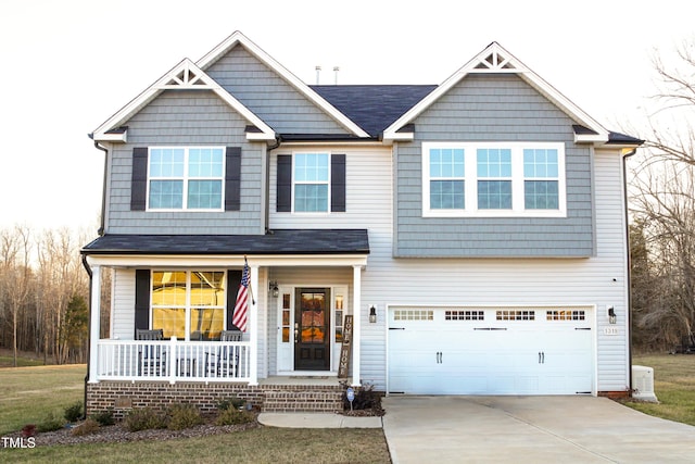 craftsman inspired home with a porch and a garage