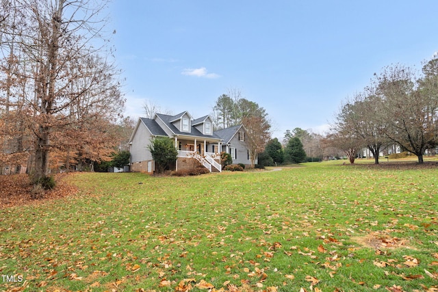 view of property exterior with a lawn and covered porch