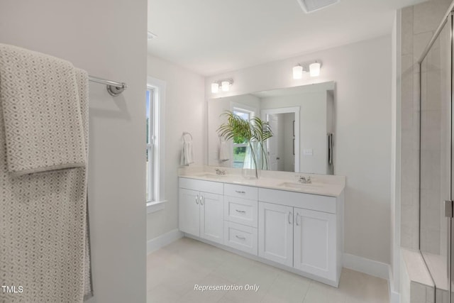 bathroom with vanity and a shower with shower door