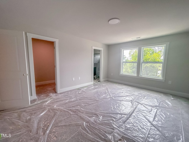 unfurnished bedroom featuring baseboards
