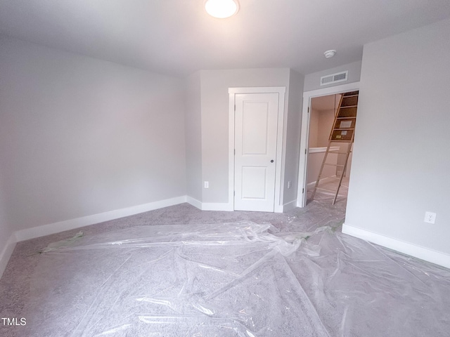 unfurnished room featuring baseboards
