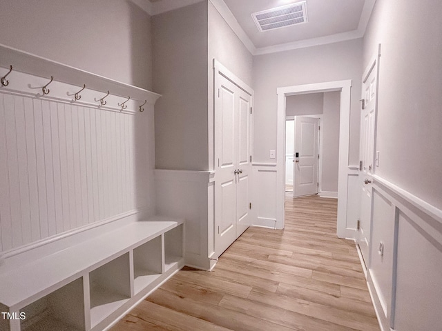 207 Pond View Ct Unit 3, Fuquay Varina, NC 27526 - mudroom featuring light wood-style flooring, ornamental molding, and wainscoting