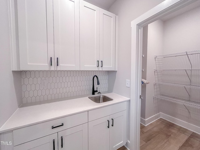207 Pond View Ct Unit 3, Fuquay Varina, NC 27526 - kitchen with a sink, white cabinets, dark wood-style floors, and decorative backsplash