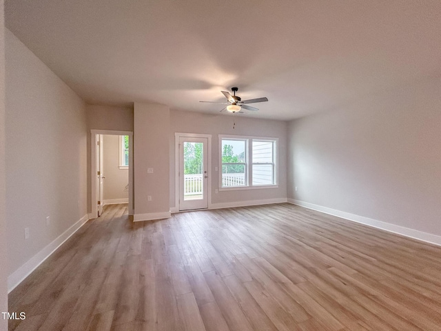 207 Pond View Ct Unit 3, Fuquay Varina, NC 27526 - unfurnished living room with ceiling fan, wood finished floors, and baseboards